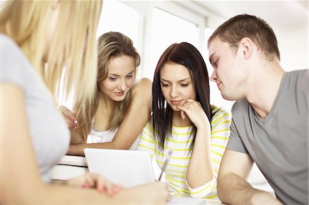 Teenagers using laptop together Stock Photo - Premium Royalty-Free, Code: 649-06622662