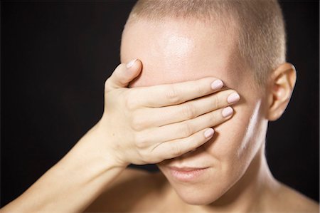 sad woman with short hair - Nude woman covering her eyes Stock Photo - Premium Royalty-Free, Code: 649-06622683