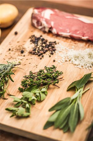 fresh herb - Board laid with meat and seasonings Stock Photo - Premium Royalty-Free, Code: 649-06622967