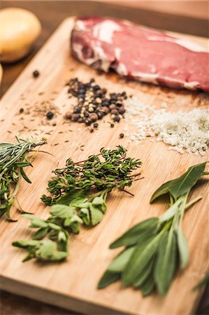 seasonings ingredients - Board laid with meat and seasonings Stock Photo - Premium Royalty-Free, Code: 649-06622967