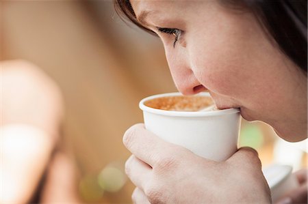 simsearch:649-06622991,k - Close up of woman drinking cup of coffee Stock Photo - Premium Royalty-Free, Code: 649-06622988