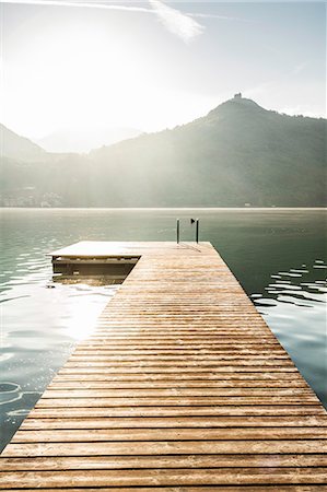 sunny dock - Wooden pier in still rural lake Stock Photo - Premium Royalty-Free, Code: 649-06623003