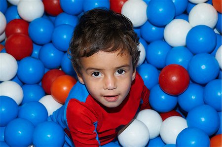 Boy playing in ball pit Stock Photo - Premium Royalty-Free, Code: 649-06623023