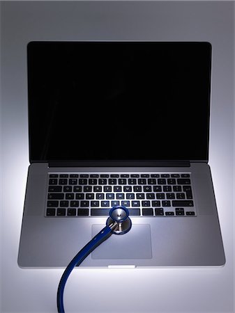 simsearch:700-06701940,k - Stethoscope on laptop computer Stock Photo - Premium Royalty-Free, Code: 649-06716510