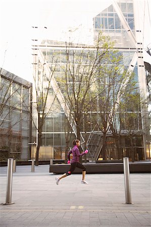 speed - Woman running on city street Stock Photo - Premium Royalty-Free, Code: 649-06716525