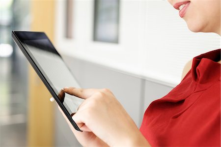 finger - Close up of woman using tablet computer Stock Photo - Premium Royalty-Free, Code: 649-06716694