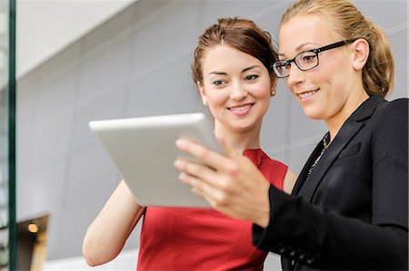suit friends - Businesswomen using tablet computer Stock Photo - Premium Royalty-Free, Code: 649-06716697