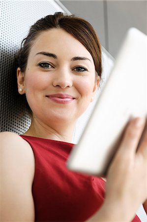 Businesswoman using tablet computer Stock Photo - Premium Royalty-Free, Code: 649-06716692