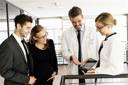 sonography lab coat - Doctors and business people with tablet Stock Photo - Premium Royalty-Free, Code: 649-06716740