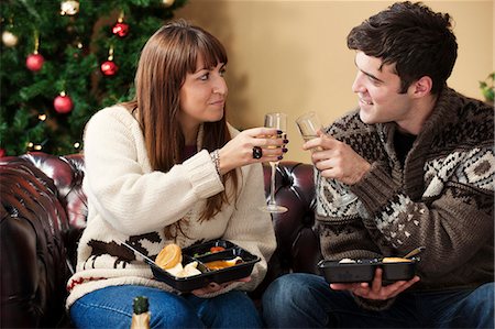 romantic dinner couple - Couple toasting each other on sofa Stock Photo - Premium Royalty-Free, Code: 649-06716876