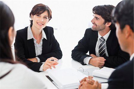 Business people talking in meeting Photographie de stock - Premium Libres de Droits, Code: 649-06717065