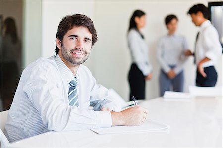 simsearch:6113-07147948,k - Businessman taking notes in meeting Stock Photo - Premium Royalty-Free, Code: 649-06717077