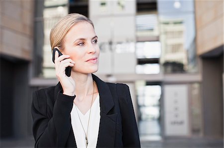 Businesswoman talking on cell phone Stock Photo - Premium Royalty-Free, Code: 649-06717164