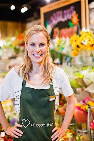 Grocer smiling in florist section Stock Photo - Premium Royalty-Free, Code: 649-06717201