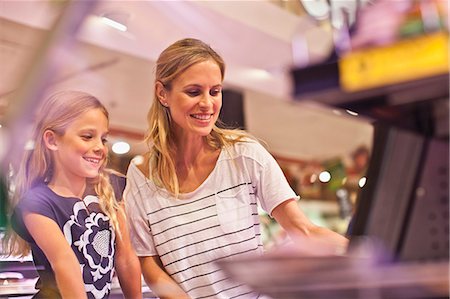 shopper at supermarket - Mother and daughter in grocery store Stock Photo - Premium Royalty-Free, Code: 649-06717228