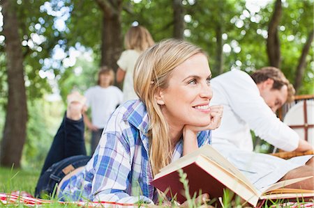 picnic at a park - Woman reading on blanket in park Stock Photo - Premium Royalty-Free, Code: 649-06717239