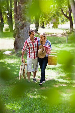 forest walk - Couple with picnic basket in park Stock Photo - Premium Royalty-Free, Code: 649-06717247