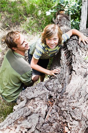 simsearch:6108-06905633,k - Father helping son over fallen tree Stock Photo - Premium Royalty-Free, Code: 649-06717266