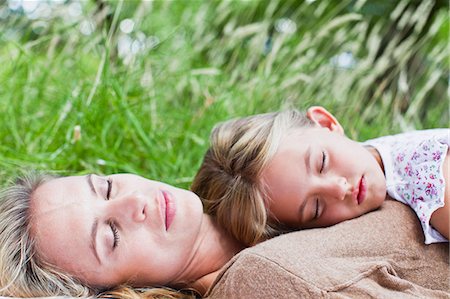 sleeping two child - Mother and daughter napping in grass Stock Photo - Premium Royalty-Free, Code: 649-06717267