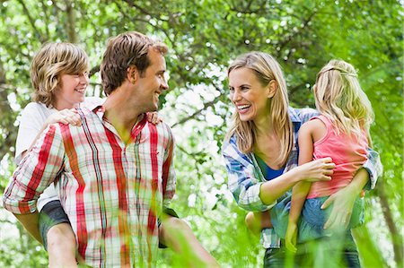 family outdoors not water not beach not winter not fall not 20s - Family walking together in park Stock Photo - Premium Royalty-Free, Code: 649-06717260