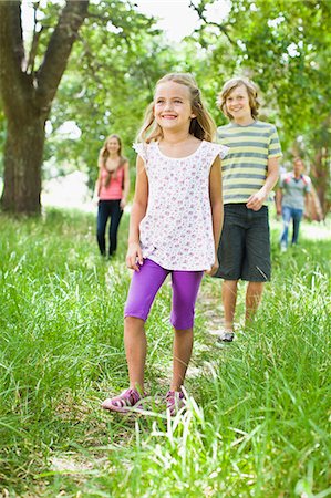 preteen girls in park - Children walking together in grass Stock Photo - Premium Royalty-Free, Code: 649-06717263