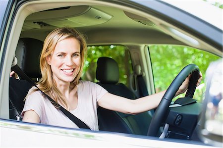 Smiling woman sitting in car Stock Photo - Premium Royalty-Free, Code: 649-06717278