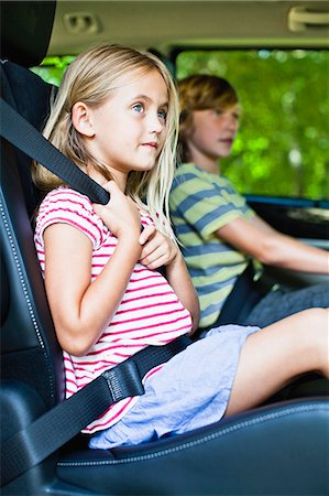 seatbelts - Girl sitting in car booster seat Stock Photo - Premium Royalty-Free, Code: 649-06717282