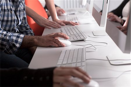 four hands - People using computers at desk Stock Photo - Premium Royalty-Free, Code: 649-06717372