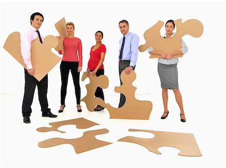 enigma - Business people doing jigsaw puzzle Foto de stock - Sin royalties Premium, Código: 649-06717411