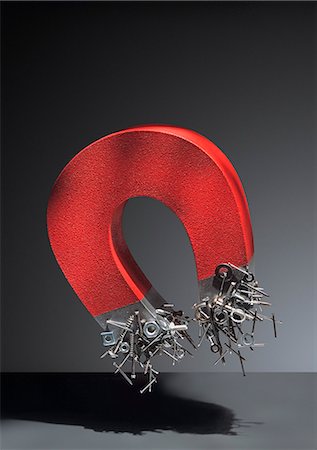 Metal objects attached to magnet Stock Photo - Premium Royalty-Free, Code: 649-06717430