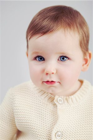 redhead baby girl - Close up of baby girls face Foto de stock - Sin royalties Premium, Código: 649-06717460