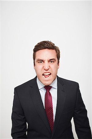 sad mans - Businessman yelling indoors Stock Photo - Premium Royalty-Free, Code: 649-06717563