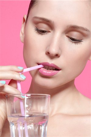 drinking straw - Close up of woman drinking with straw Stock Photo - Premium Royalty-Free, Code: 649-06717822