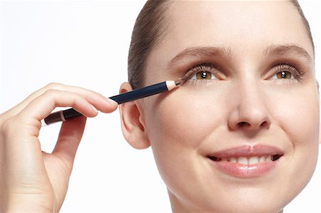 pencil (cosmetics) - Close up of woman applying makeup Foto de stock - Sin royalties Premium, Código: 649-06717838