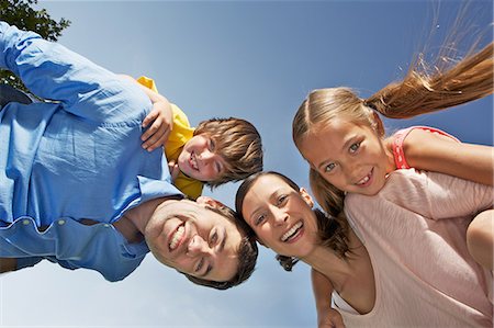 family looking up - Portrait of family with two children from below Stock Photo - Premium Royalty-Free, Code: 649-06812441