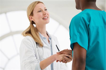 Two doctors shaking hands Stock Photo - Premium Royalty-Free, Code: 649-06812585