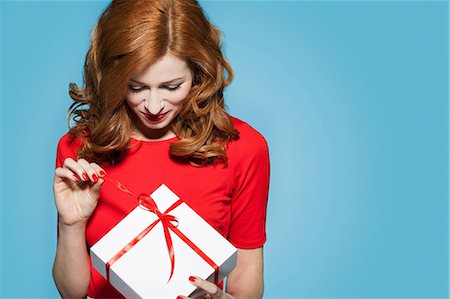 red happy - Woman holding white gift box with red bow Stock Photo - Premium Royalty-Free, Code: 649-06812639