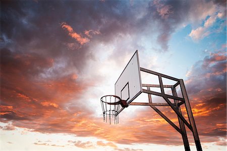 Basketball hoop and dramatic sky Stock Photo - Premium Royalty-Free, Code: 649-06812729