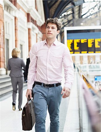 photo man train station - Casual businessman walking with briefcase Stock Photo - Premium Royalty-Free, Code: 649-06812885