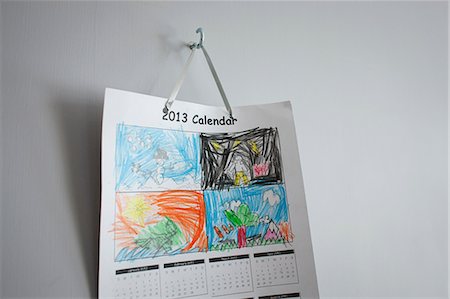 Childhood drawings on calendar hanging on wall Stock Photo - Premium Royalty-Free, Code: 649-06829575