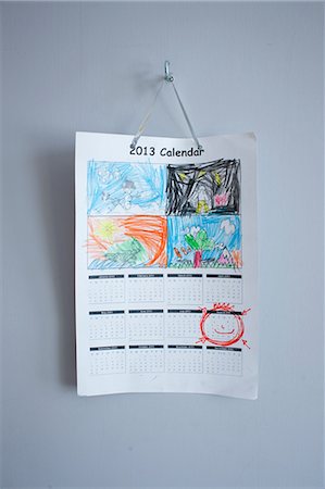 Childhood drawings on calendar hanging on wall Stock Photo - Premium Royalty-Free, Code: 649-06829576