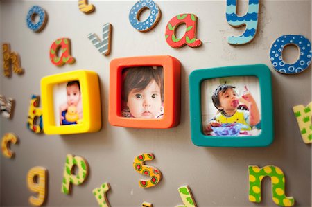 simsearch:649-06829577,k - Childhood photographs and picture on wall Stock Photo - Premium Royalty-Free, Code: 649-06829577