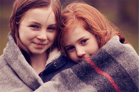 preteen girl redhead - Portrait of girls wrapped in a blanket outdoors Stock Photo - Premium Royalty-Free, Code: 649-06829594