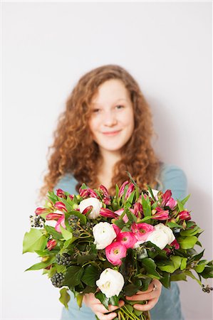 flower fresh - Portrait of teenage girl holding bouquet of fresh flowers Stock Photo - Premium Royalty-Free, Code: 649-06829645