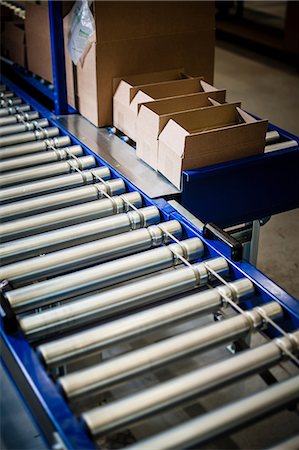 simsearch:649-06829904,k - Detail of stationary conveyer belt in distribution warehouse Stock Photo - Premium Royalty-Free, Code: 649-06829903