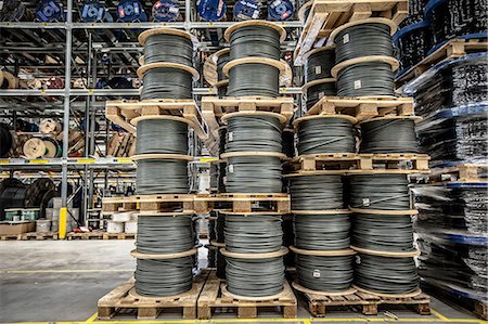 Cable drums stacked on pallets in warehouse Stock Photo - Premium Royalty-Free, Code: 649-06829925