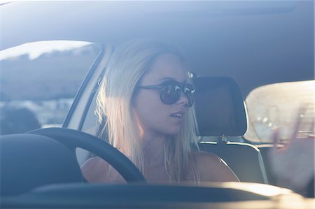 Young blonde women in car wearing sunglasses Stock Photo - Premium Royalty-Free, Code: 649-06829954