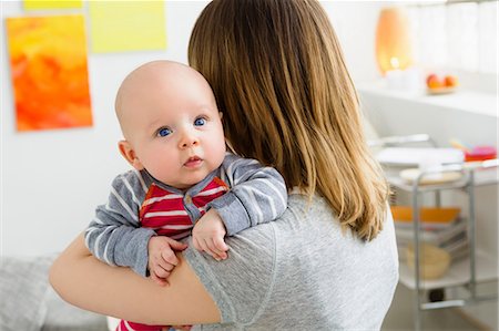 simsearch:649-06830000,k - Mother holding baby son over shoulder Stock Photo - Premium Royalty-Free, Code: 649-06829988