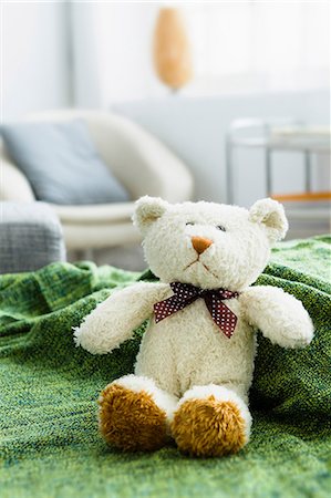 furry teddy bear - Teddy bear on green blanket Stock Photo - Premium Royalty-Free, Code: 649-06829994