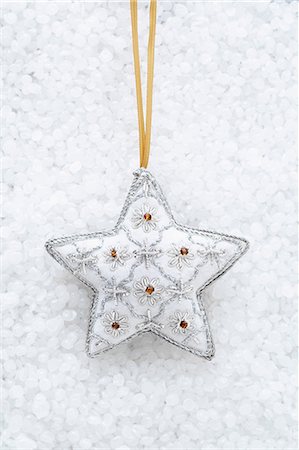 silver color - White star shaped christmas decoration Stock Photo - Premium Royalty-Free, Code: 649-06830073